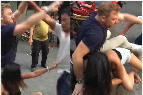 柬埔寨街头上演夫妻互殴 因丈夫怀疑妻子出轨