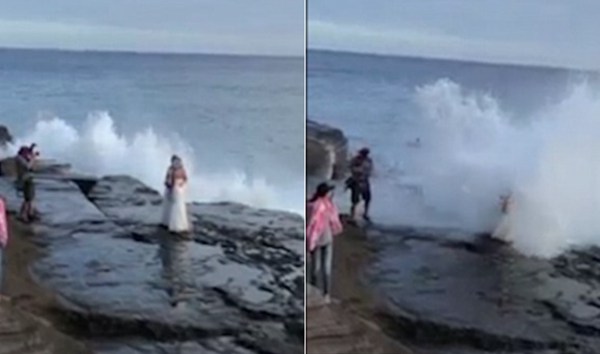 透心凉！两女子海边拍婚纱照被海浪打湿