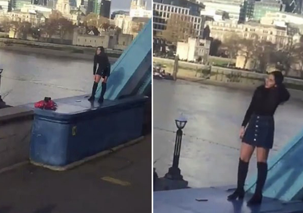 太危险！英女子爬上伦敦塔桥寒风中露腿自拍