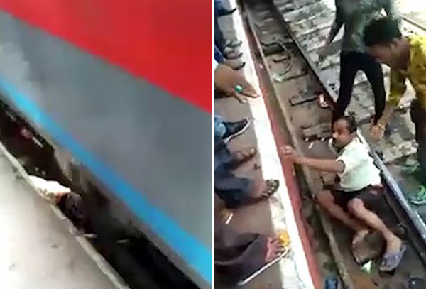 印一男子穿越铁轨突遇火车驶来 俯卧躲过一劫